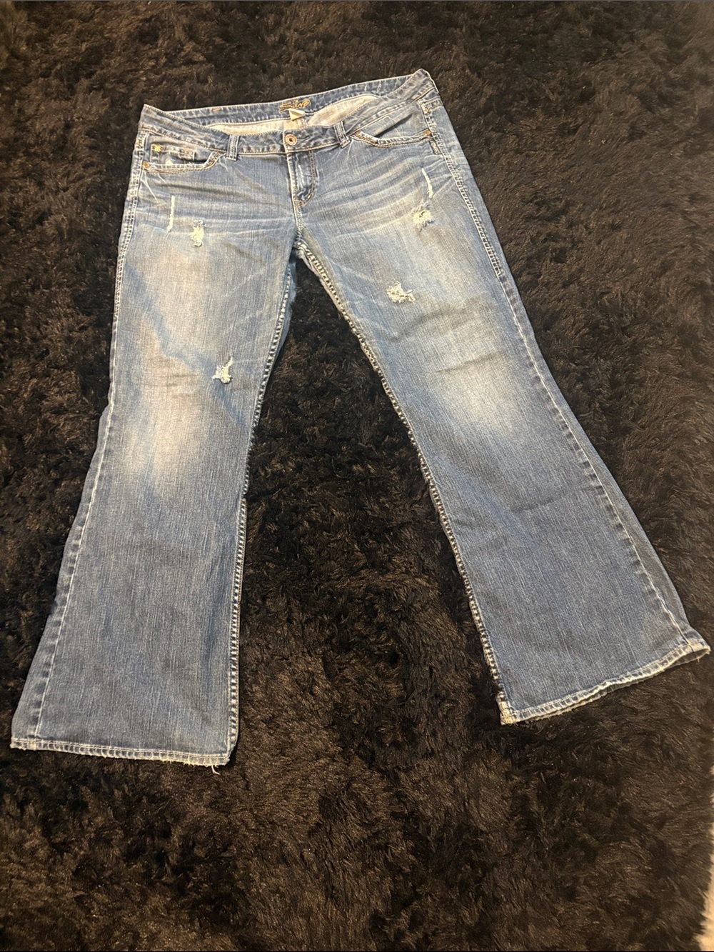 Silver Jeans Light Blue Flare Jeans with Distressed Accents